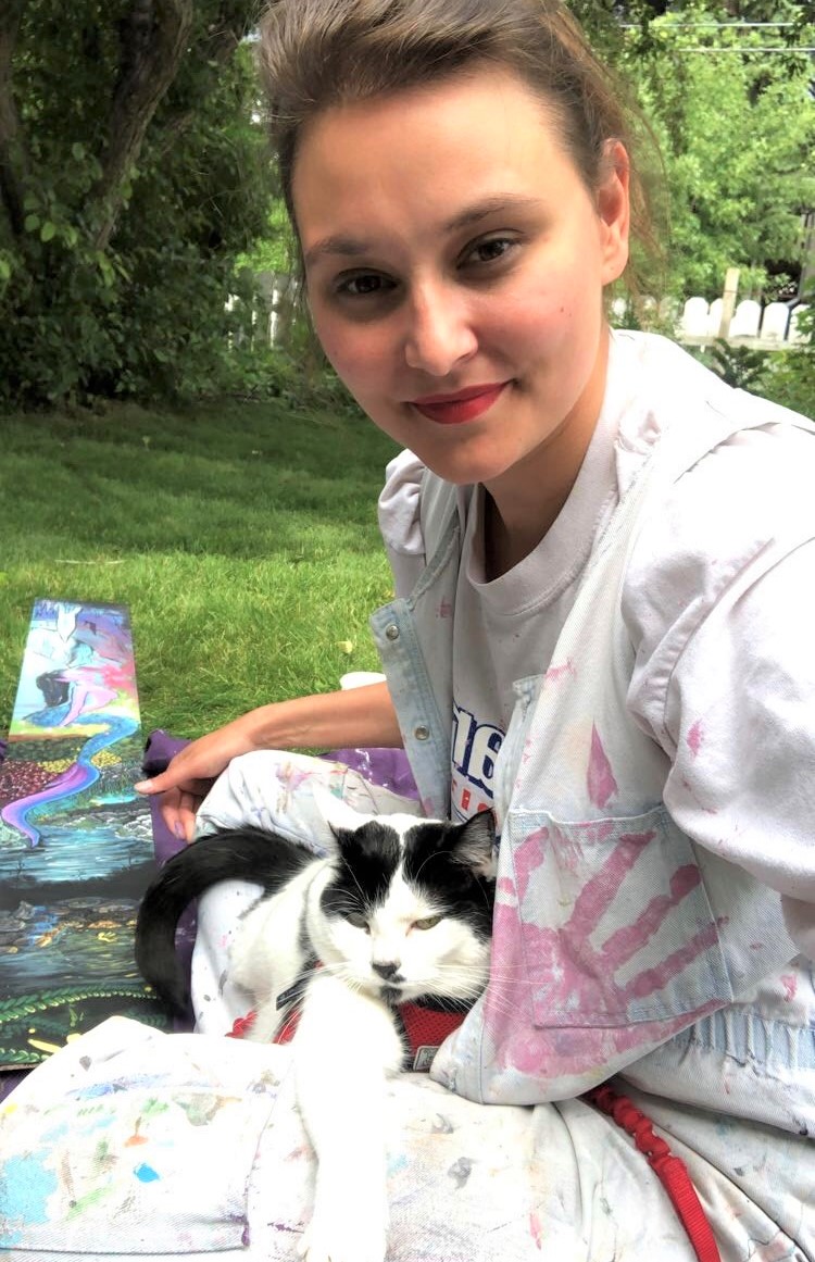 Scarlett painting with her cat Alexis